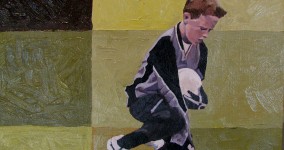 Portrait of boy playing football